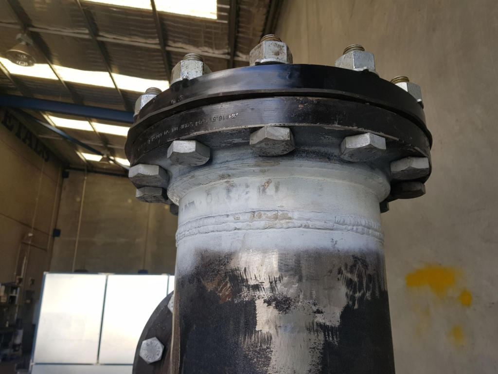 Metal pipe spool in warehouse